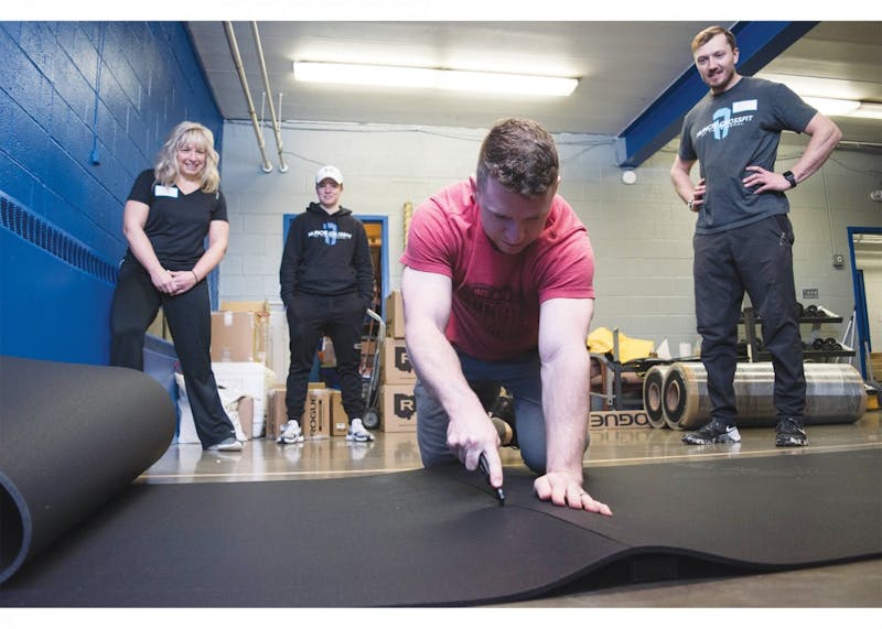 Volunteers from Muncie Crossfit reconstruct the gym room at the Boys &amp; Girls Clubs of Muncie (BGC), Jan. 17, 2019, with new equipment and new matting. The BGC of Muncie has raised more than $56,500 of their $85,000 goal. Stephanie Amador, DN&nbsp;