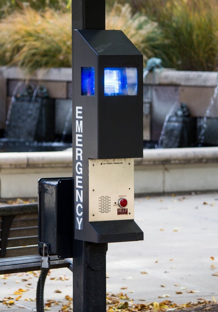 The campus blue light beside the Frog Baby fountain, Nov. 2, Grace Ramey // DN