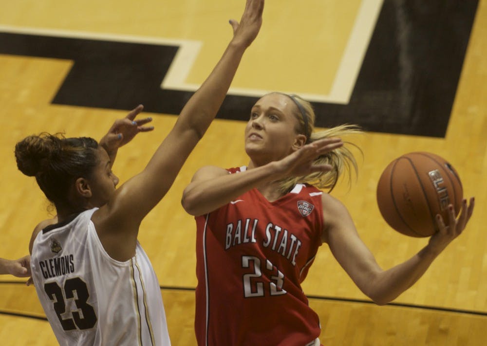 Ball State junior guard Brittany Carter drives to the hoop against Purdue University forward Liza Clemons on Nov. 10 at Mackey Arena. DN PHOTO MARCEY BURTON