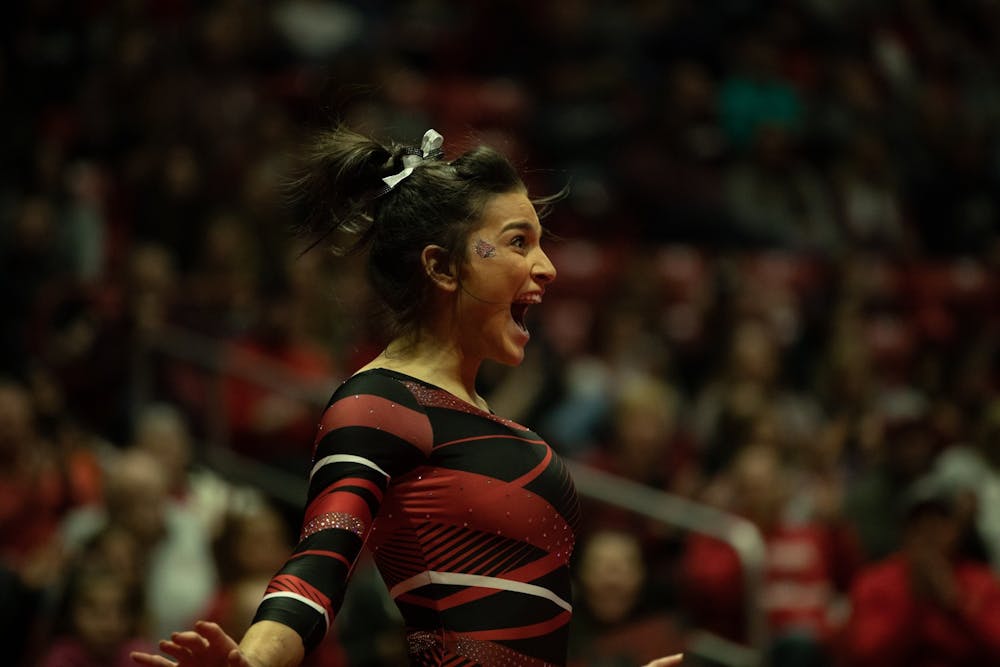 <p>Junior Claudia Goyco celebrates after finishing her floor routine, Jan. 26, 2020, in John E. Worthen Arena. Goyco scored 9.900 in her event. <strong>Jacob Musselman, DN</strong></p>