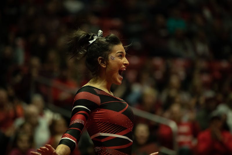 Junior Claudia Goyco celebrates after finishing her floor routine, Jan. 26, 2020, in John E. Worthen Arena. Goyco scored 9.900 in her event. Jacob Musselman, DN