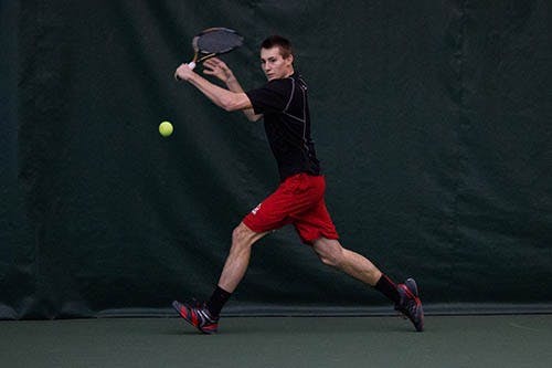 Ray Lewis attempts to hit the tennis ball during the match Feb. 20 at the Muncie YMCA. DN PHOTO TAYLOR IRBY