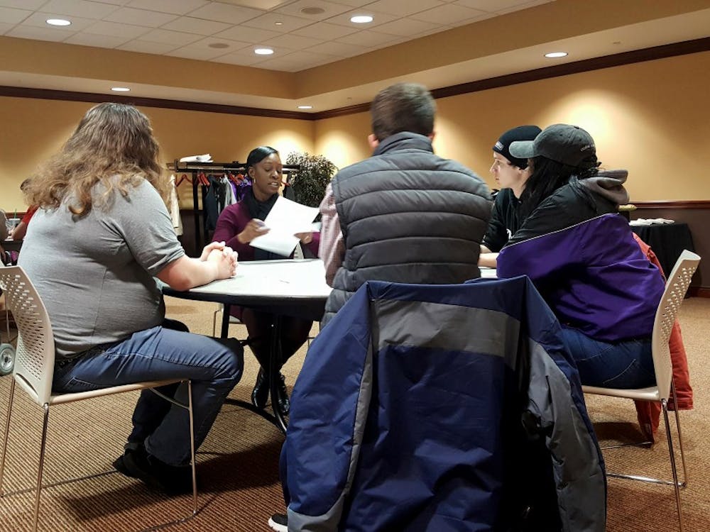 One of five tables in the forum room talks about disability awareness on campus at a Beneficence Dialogue in the L.A. Pittenger Student Center March 1. Sara Barker, DN