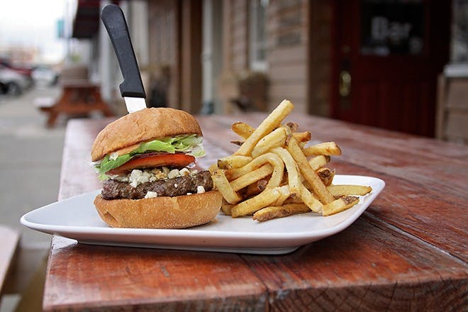 Chipotle Lamb Burger – $14.00Matt and Jessica Burns are the owners and chefs of Barn Brasserie, a downtown restaurant that specializes in American classics with French inspirations. The Burns’ try to use local and organic food in their creations to support local farmers and promote a healthy diet. The Chipotle Lamb Burger prevails over the countless creative burgers they serve. Mint salsa, feta cheese crumbles, lettuce, tomatoes and chipotle mayonnaise top the succulent lamb patty. When asked how they create their unique hamburgers, Matt Burns said, “We just look at the ingredients that we have around and try to figure out a way to use them. Just come up with crazy stuff and pick one that works.”