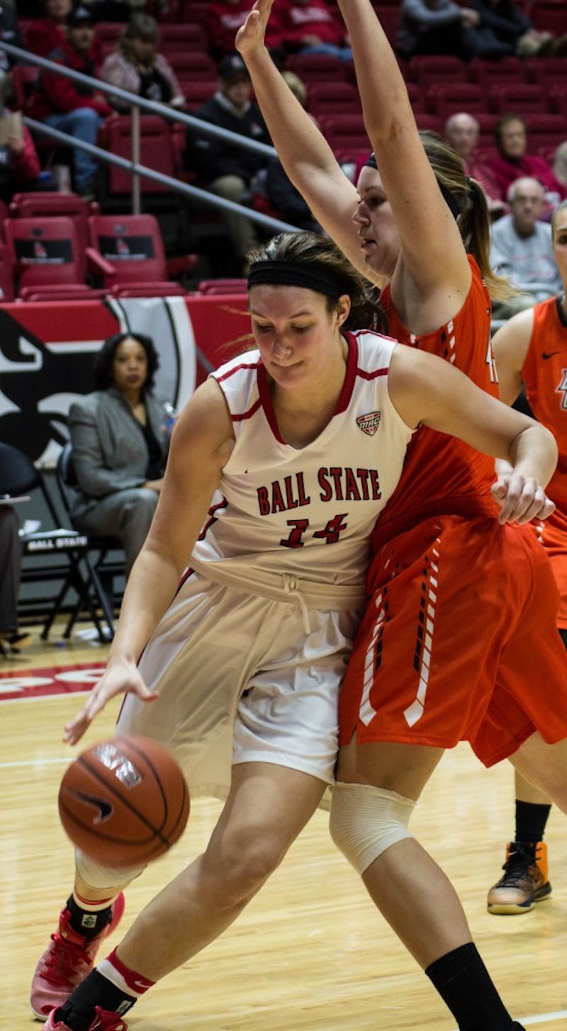 Senior center Renee Bennett attempts to get past a Bowling Green player to shoot a layup during the game on Feb. 8 in Worthen Arena. The Cardinals won 91-70. Grace Ramey // DN