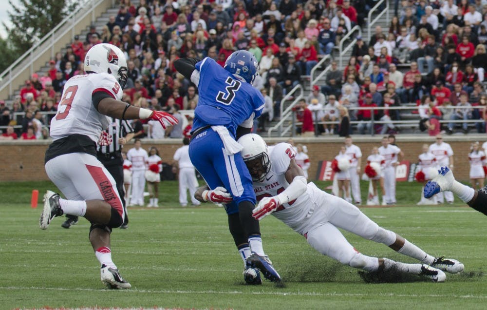 Redshirt sophomore safety Martez Hester attempts to tackle an Indiana State player during the game on Sept. 13 at Scheumann Stadium. DN PHOTO BREANNA DAUGHERTY 