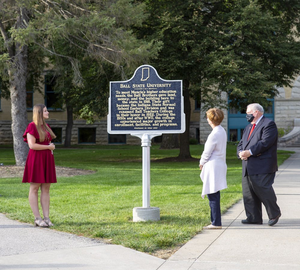 <p>Ball State Board of Trustees Student Member Amy Wyse reads the new historical marker during the unveiling ceremony Sept. 30, 2021. The marker celebrates Ball State&#x27;s centennial, achieved in 2018. <strong>Eli Houser, DN</strong></p>