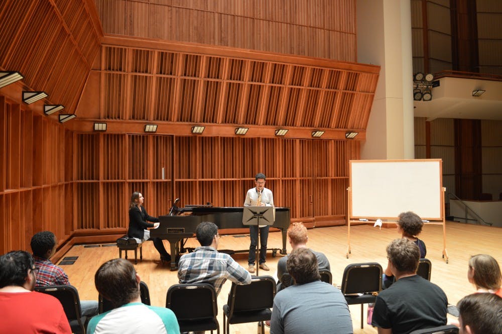 <p>Gabriel Sanchez, a first year graduate student in saxophone performance, performs in front of a class to receive feedback from Preston Duncan, a&nbsp;saxophone teacher at the University of Minnesota, on how to improve his technique.&nbsp;The class was part of Saxtemberfest, the 20th&nbsp;annual event series for student musicians. <em style="background-color: initial;">Margo Morton // DN&nbsp;</em></p>