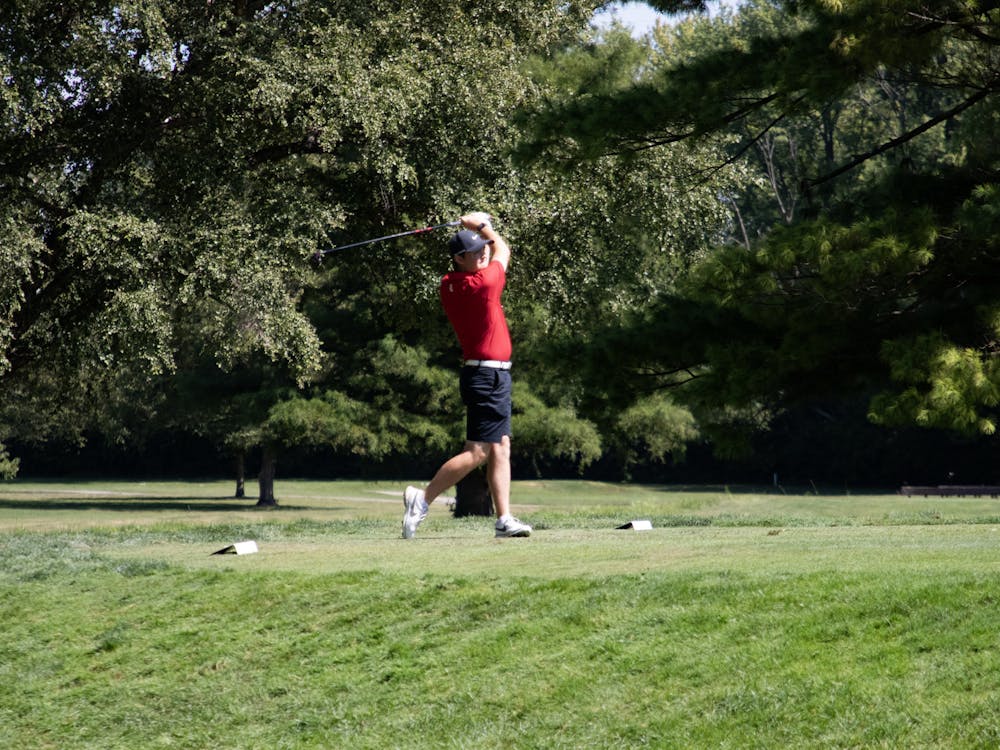 Sophomore Carter Smith drives the ball at the Earl Yestingsmeier Invitational at the Delaware Country Club Sept. 10. The Cardinals claimed the team championship. Aulani Ho, DN