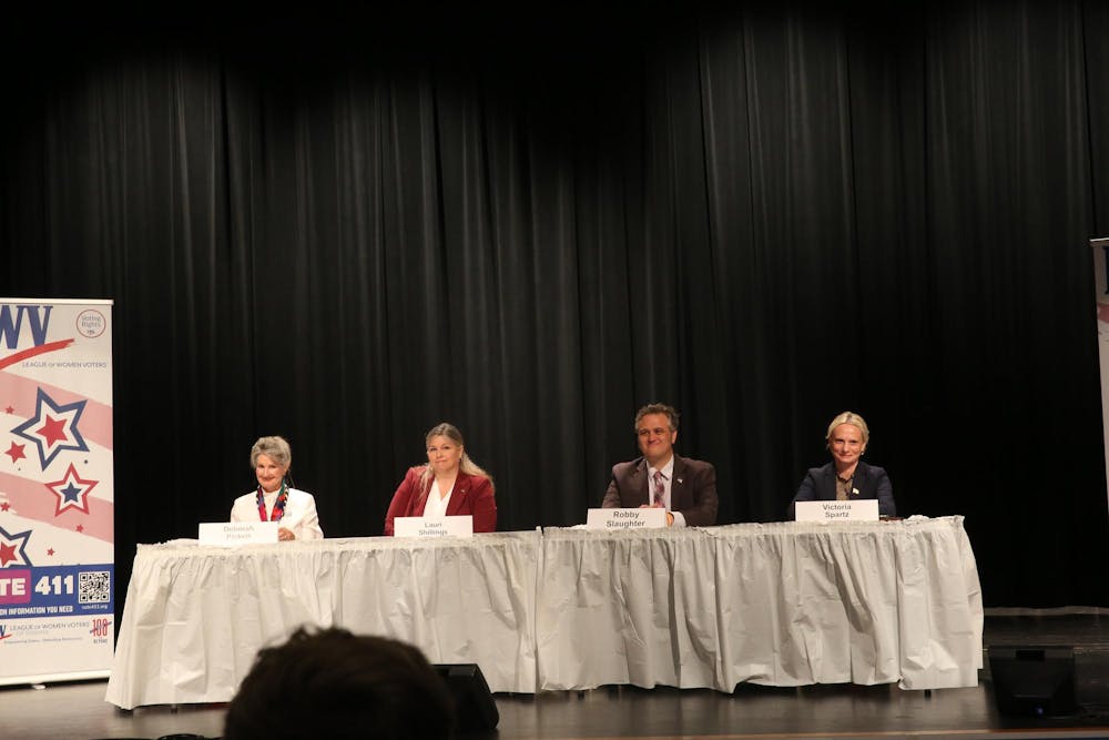 Indiana fifth district congressional seat candidates prepare for a community forum September 12 insided Anderson High School. Many topics were discussed by the candidates, including abortion, immigration, gun control, taxes and education. Shelby Anderson, DN