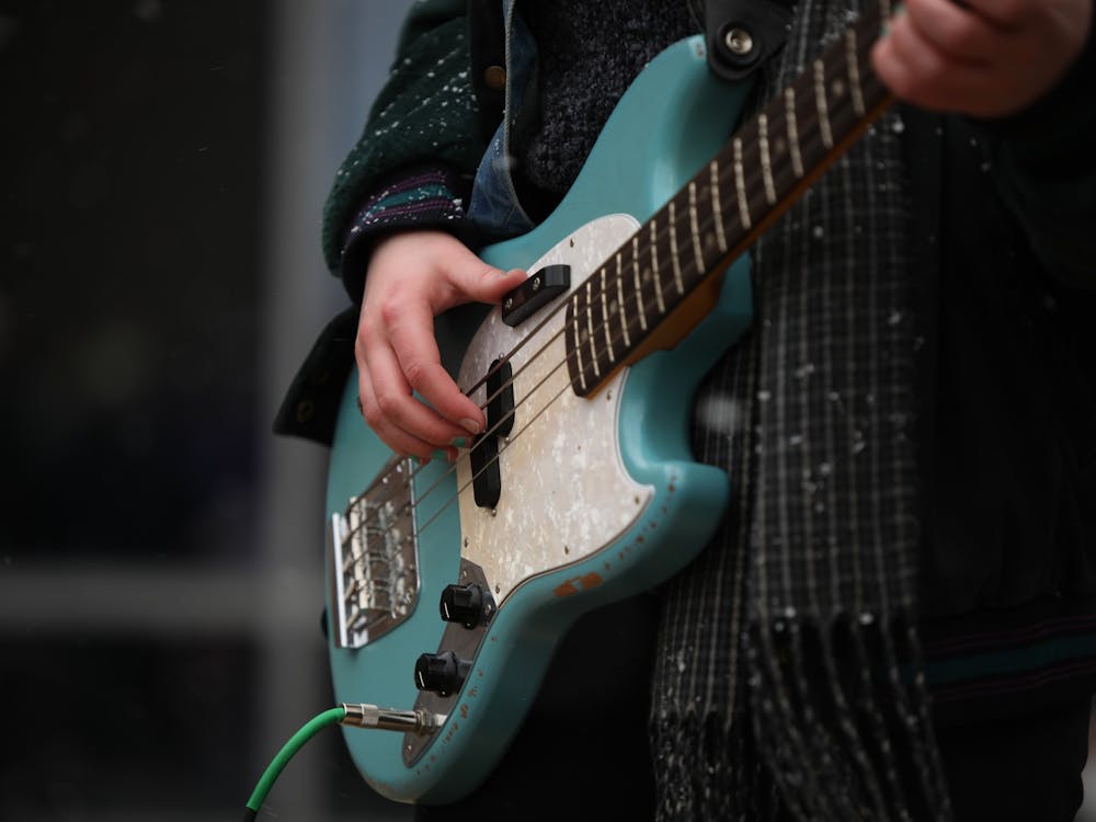 Emily Parks plays her bass with her band "The Namby Pamby" March 26 at the Equinox Music Festival outside Botsford-Swinford Hall. The festival was organized by CCIM LLC. Rylan Capper, DN 