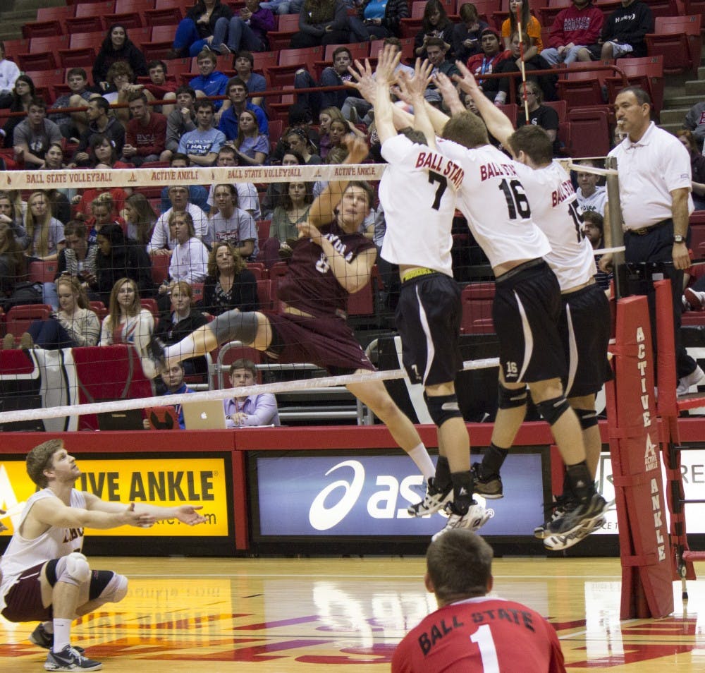 Shane Witmer, Kevin Owens and Martin Niemczewski block an attack by Loyola during the match Feb. 20 at Worthen Arena. DN PHOTO ALISON CARROLL