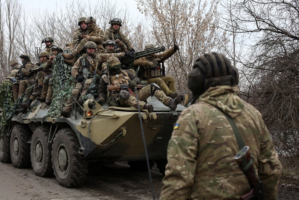 Ukrainian servicemen get ready to repel an attack in Ukraine's Lugansk region on Feb. 24, 2022. - Russian President Vladimir Putin launched a full-scale invasion of Ukraine on Thursday, killing dozens and forcing hundreds to flee for their lives in the pro-Western neighbor. (Anatolii Stepanov/AFP via Getty Images/TNS)