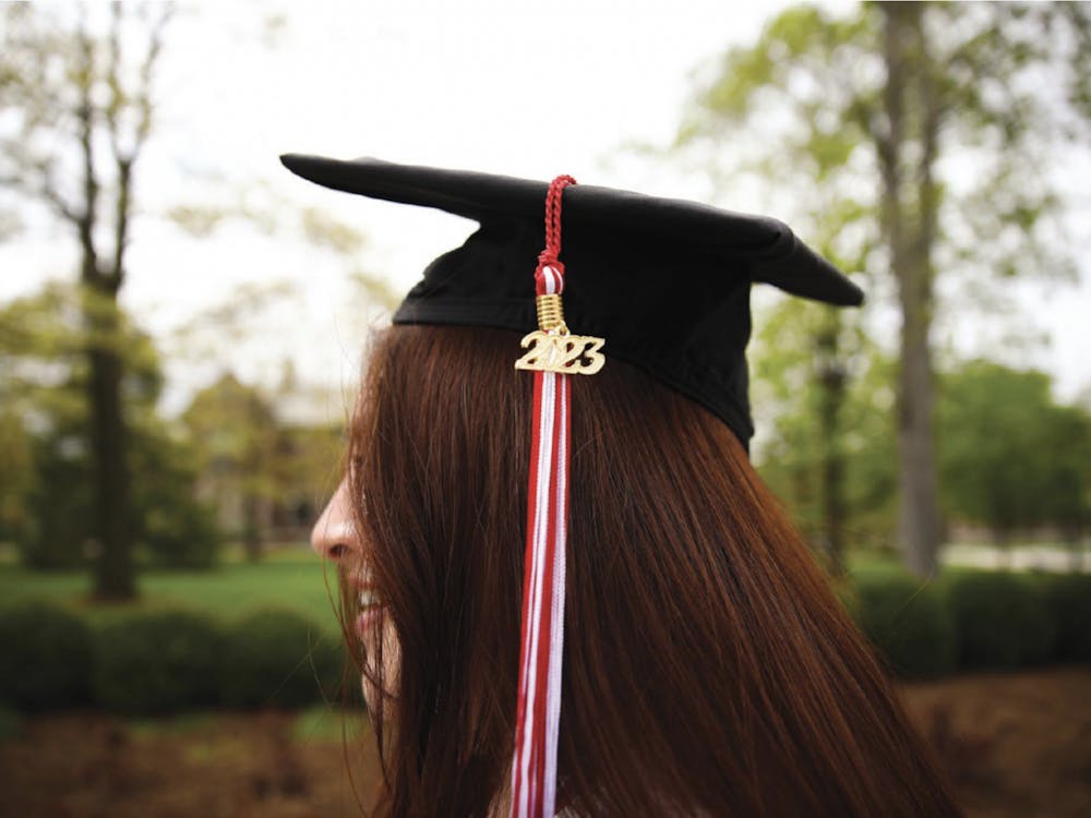 Fourth-year journalism major Angelica Gonzales Morales poses for a photo in front of Beneficence April 22. Jacy Bradley, DN