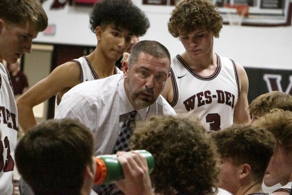 Wes-Del head coach John McGlothin talks to his team during a timeout  Feb. 10 at Wes-Del Middle/Senior High School. Zach Carter, DN