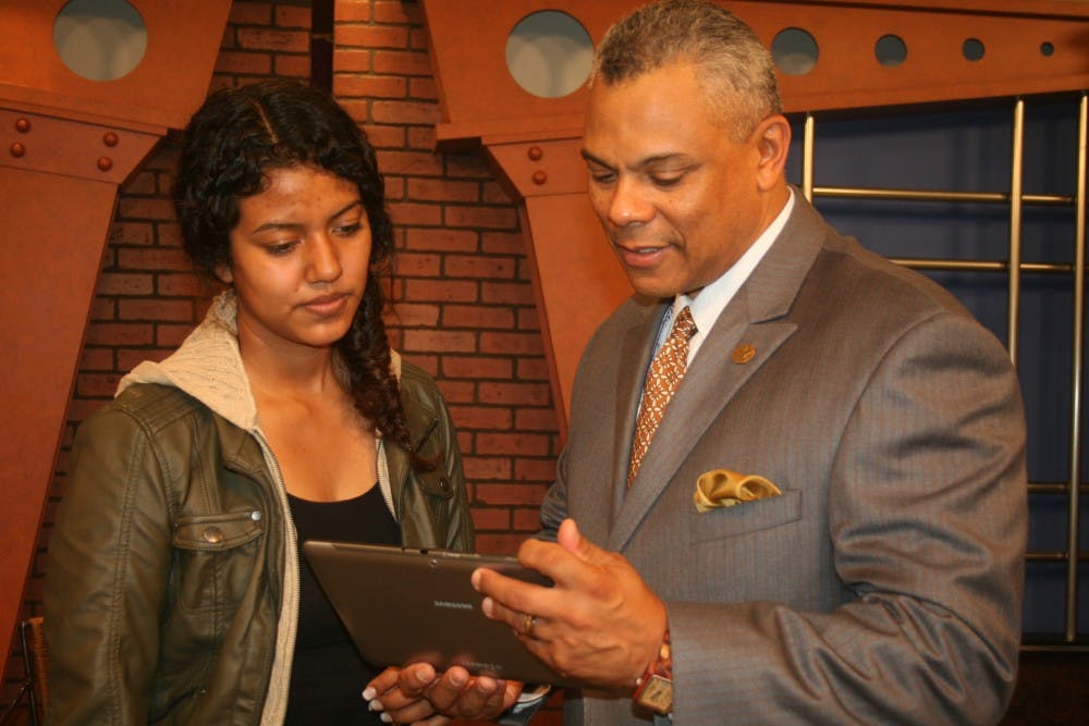 Karla Fernandez talks with BDTV adviser Dennis Goins at Ben Davis High School. Fernandez is currently raising money to attend Ball State through GoFundMe.com. PHOTO PROVIDED BY KAITLYNN LLOYD