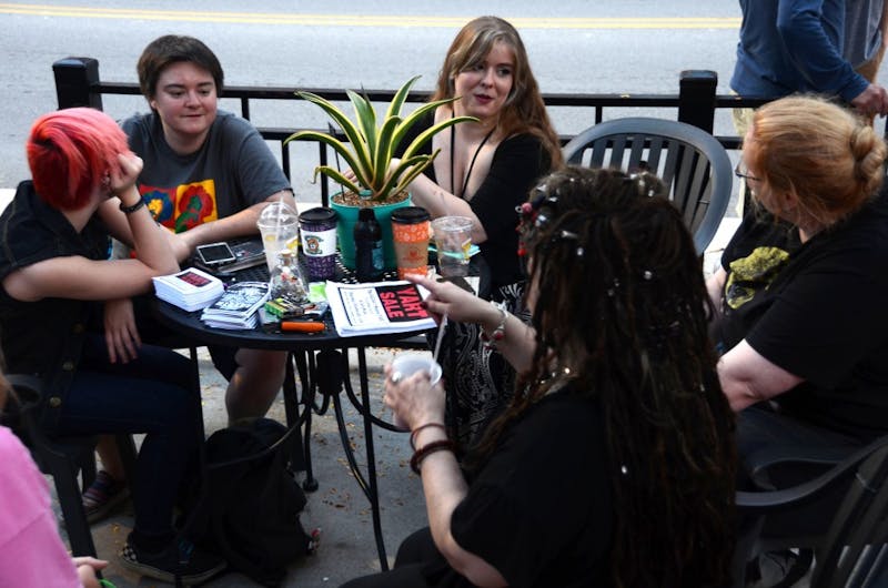 (From left) Brooklyn Lambert, Brittaney Edwards, Ricbecka Deardorff, Moth Danner, and Lucian Cruor share their stories over coffee at the weekly Stitch ’n Bitch meeting at The Cup on Sept. 17. The group talks about their week and creates art every Sunday. Kaci Alvarez, DN