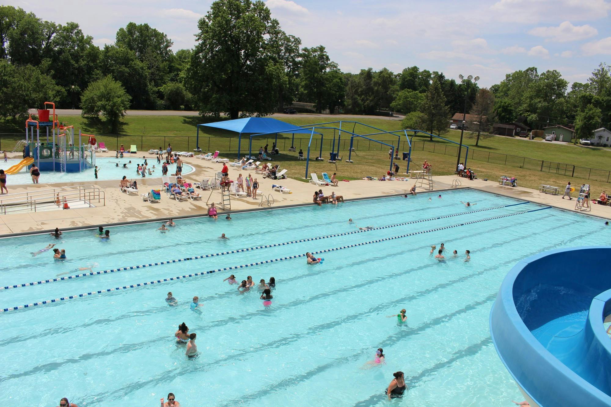 Muncie community members swim and sunbathe June 17, 2020, at Tuhey Pool. The pool opened June 15, 2020, nearly three months after the state began COVID-19 regulations. Pool staff followed state health guidelines for cleaning and social distancing. Jenna Gorsage, DN