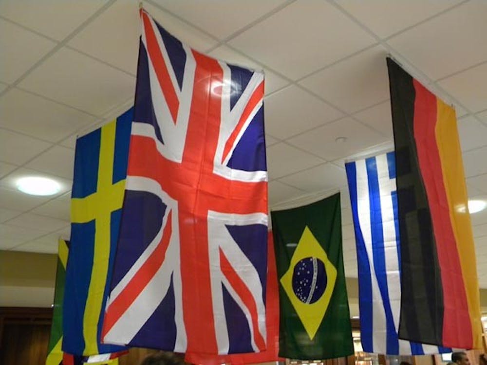 Flags from around the world hang above a study abroad fair held in the Atrium. The fair offers information and advice to students wishing to experience life in other countries. DN FILE PHOTO Logan Winslow
