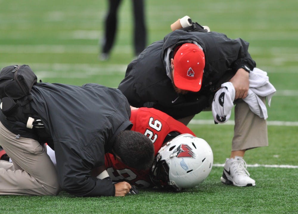 Defensive lineman Julian Jackson reacts to an injury during the game against Toledo on Oct. 3 at Scheumann Stadium. Jackson was escorted off of the field after few minutes. DN PHOTO JASON CONERLY