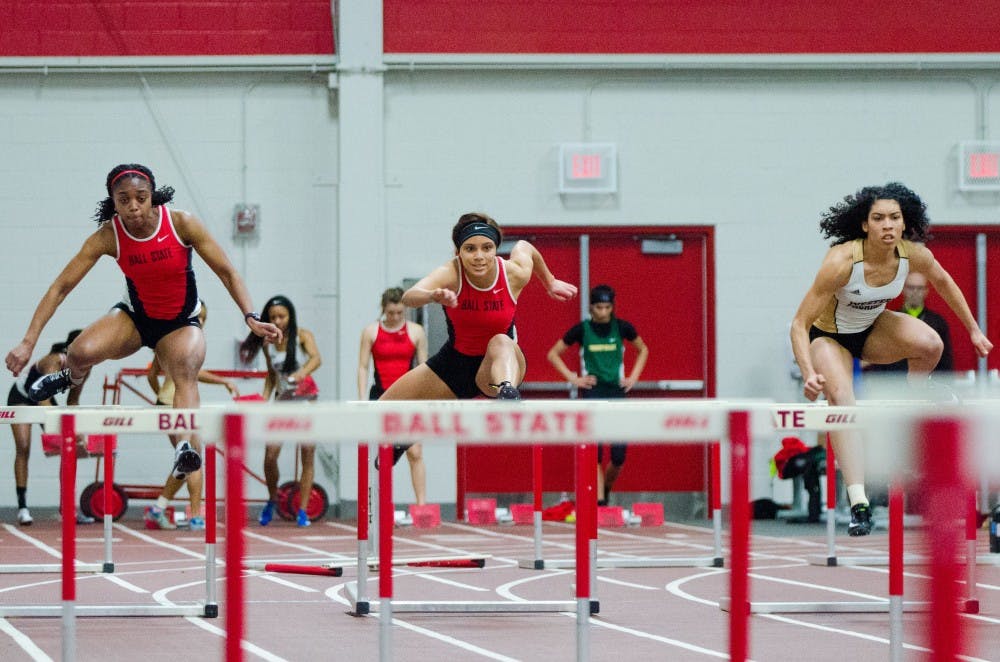 Ball State senior Anna-Kay West, left, and freshman Anasja Troutman, center, compete in the 60 meter hurdles on Feb. 16 in the Ball State Tune-up at the Field Sports building. Madeline Grosh, DN