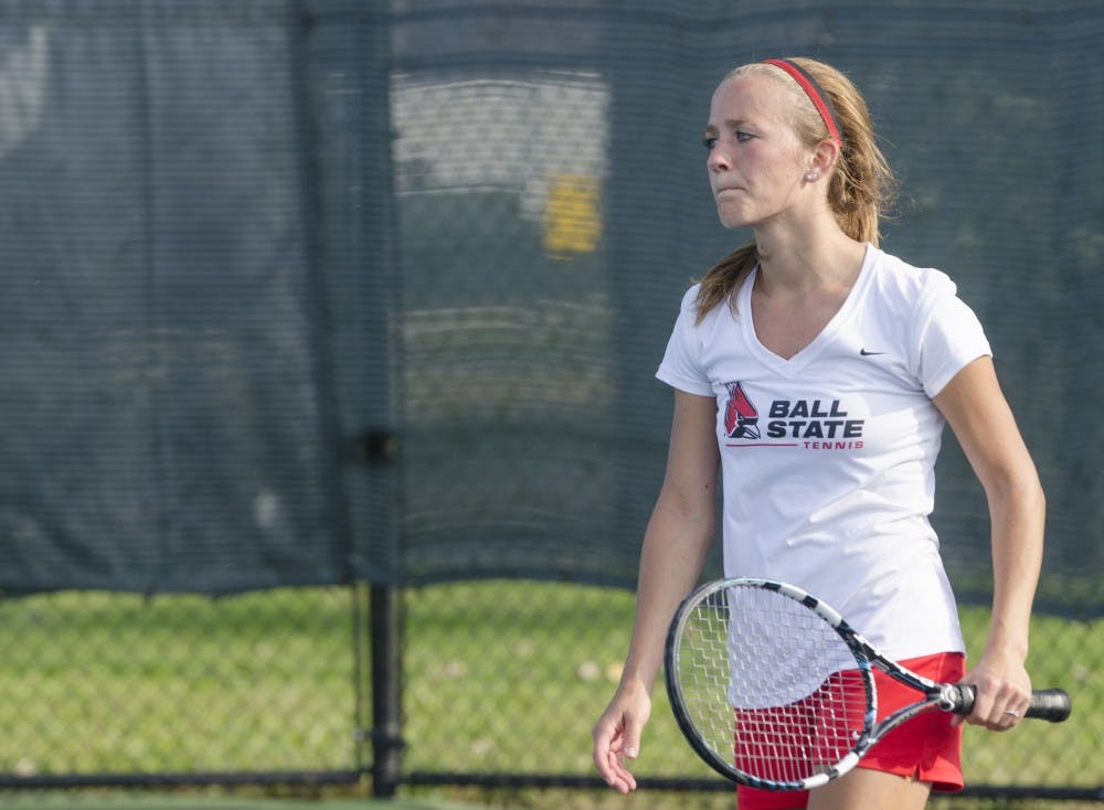 Senior Ashlyn Rang reacts to a play during her singles match against Butler for the Fall Dual on Sept. 20 at the Cardinal Creek Tennis Center. DN PHOTO BREANNA DAUGHERTY 