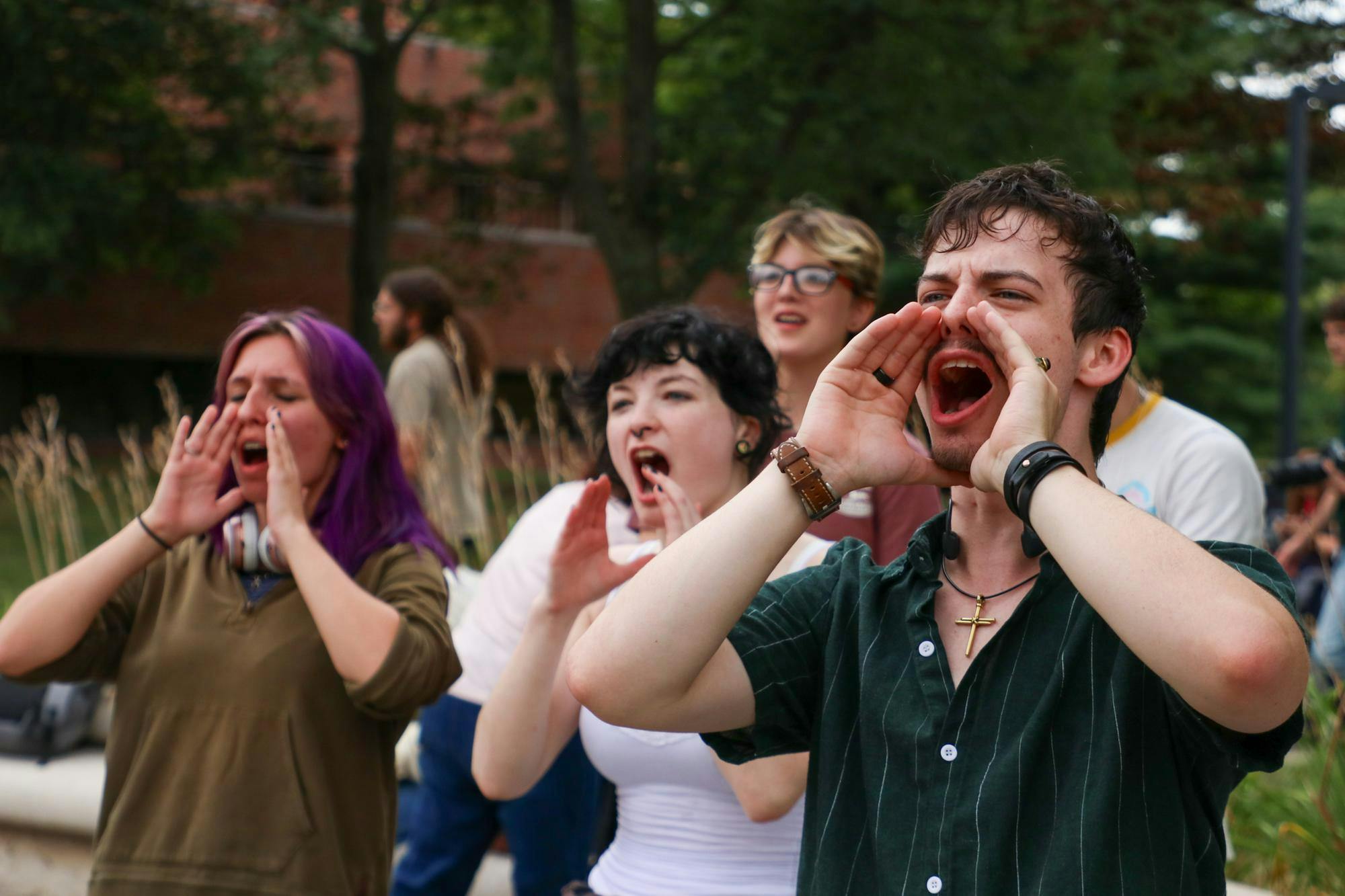 A group of students shout at a protest Aug. 22 at Ball State University. The protest was organized to speak out against police brutality. Adam Jones, DN