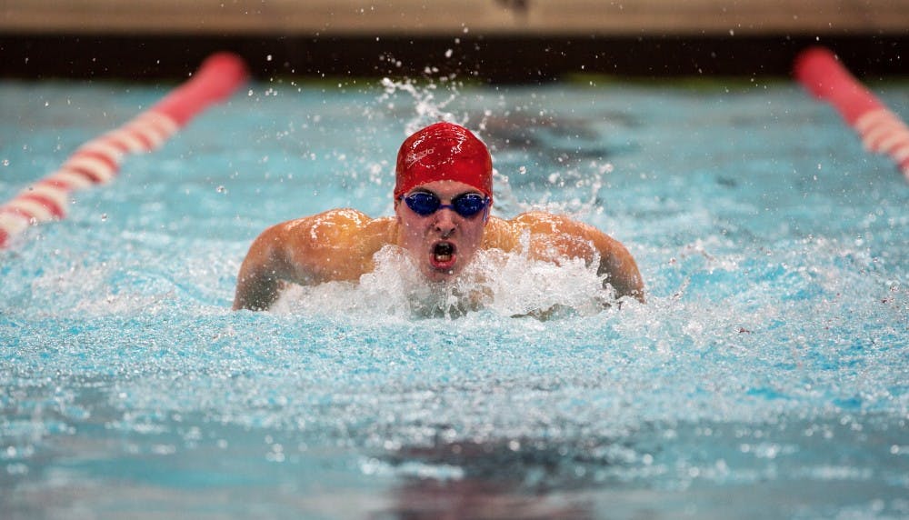 <p>Sophomore Adam Pongracz competes in the 200-yard butterfly during the meet against Grand Valley State on Nov. 18 in Lewellen Pool. <strong>Kaiti Sullivan, DN File</strong></p>