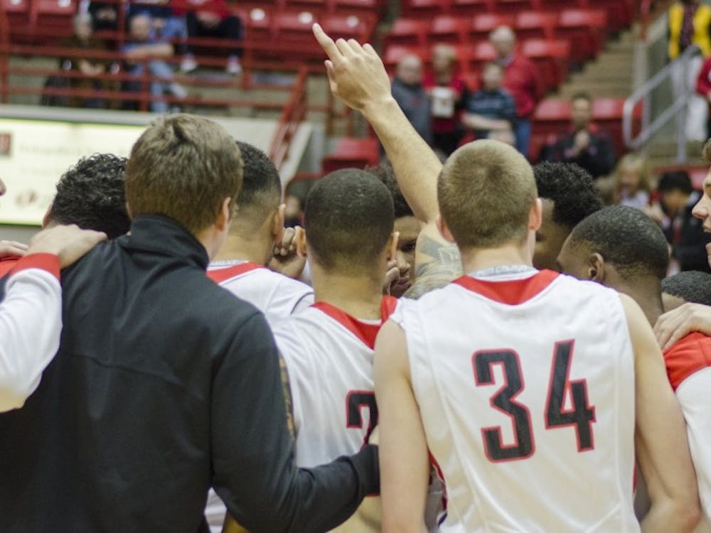 Members of the men's basketball team huddle up before the game against Bowling Green on Feb. 14 at Worthen Arena. DN PHOTO BREANNA DAUGHERTY