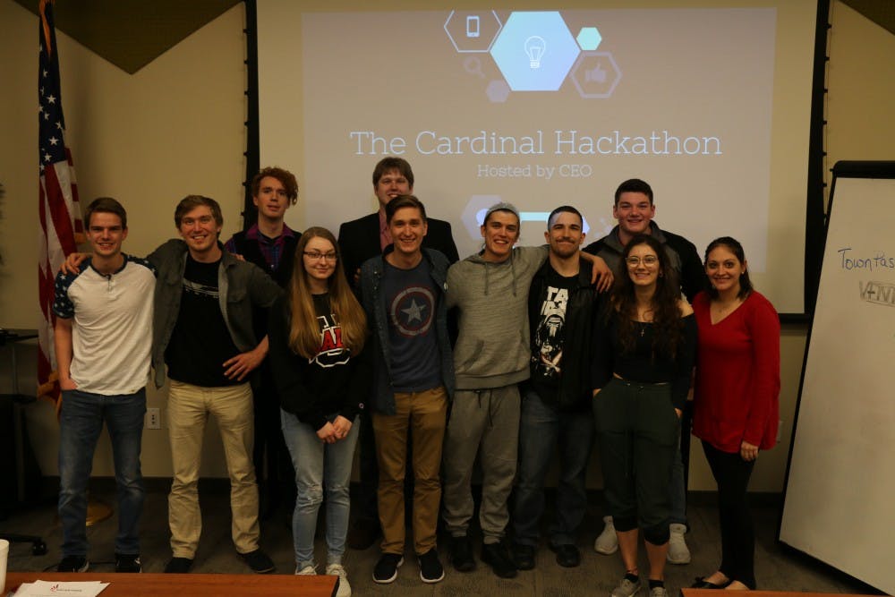 Participants at the first annual Cardinal Hackathon hosted by the Collegiate Entrepreneurs' Organization huddle for a photo March 2018. This year's second annual Hackathon will be held at the Innovation Connector and begin 6 p.m. Friday and end 6 p.m. Saturday. Brandi Lambertson, Photo Provided
