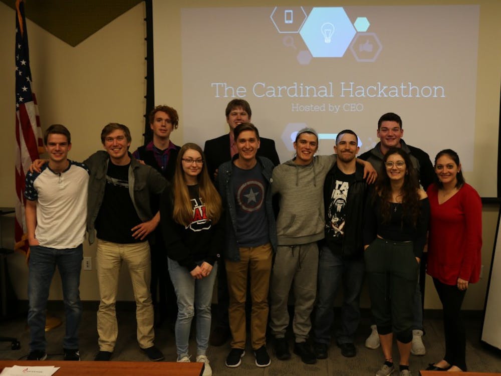 Participants at the first annual Cardinal Hackathon hosted by the Collegiate Entrepreneurs' Organization huddle for a photo March 2018. This year's second annual Hackathon will be held at the Innovation Connector and begin 6 p.m. Friday and end 6 p.m. Saturday. Brandi Lambertson, Photo Provided
