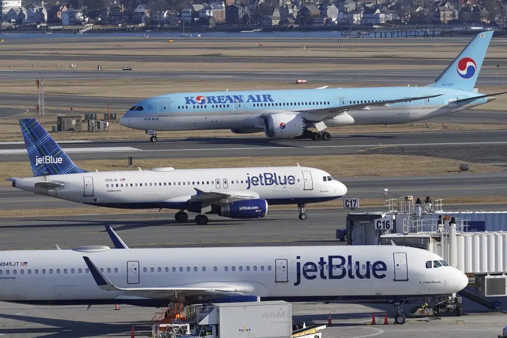 Passenger jets on the tarmac at Logan International Airport, Jan. 11, 2023, in Boston. Thousands of flight delays and cancellations rippled across the U.S. early Wednesday after computer outage led to a grounding order by the Federal Aviation Administration. (AP Photo/Steven Senne)