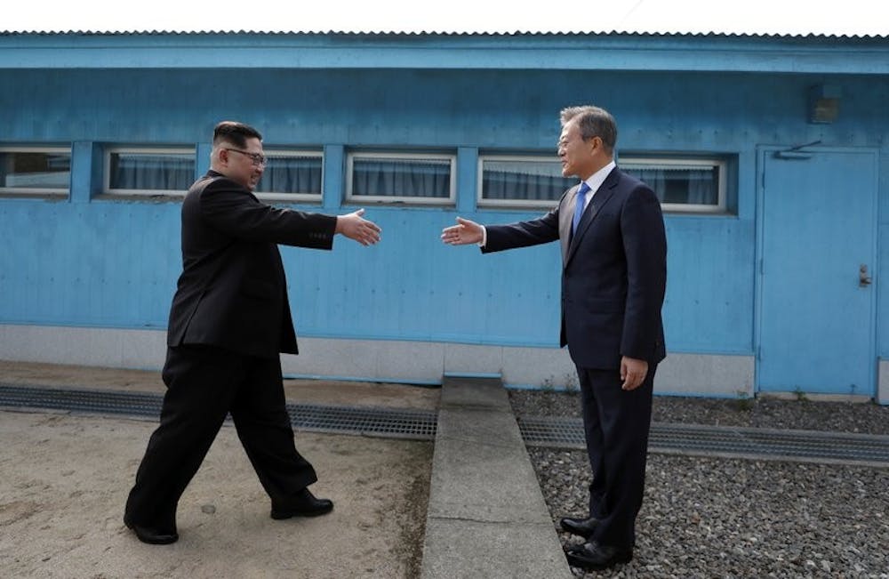 <p>North Korean leader Kim Jong Un, left, prepares to shake hands with South Korean President Moon Jae-in at the border village of Panmunjom in Demilitarized Zone Friday, April 27, 2018. Their discussions will be expected to focus on whether the North can be persuaded to give up its nuclear bombs. <strong>Korea Summit Press Pool via AP, Photo Courtesy&nbsp;</strong></p>