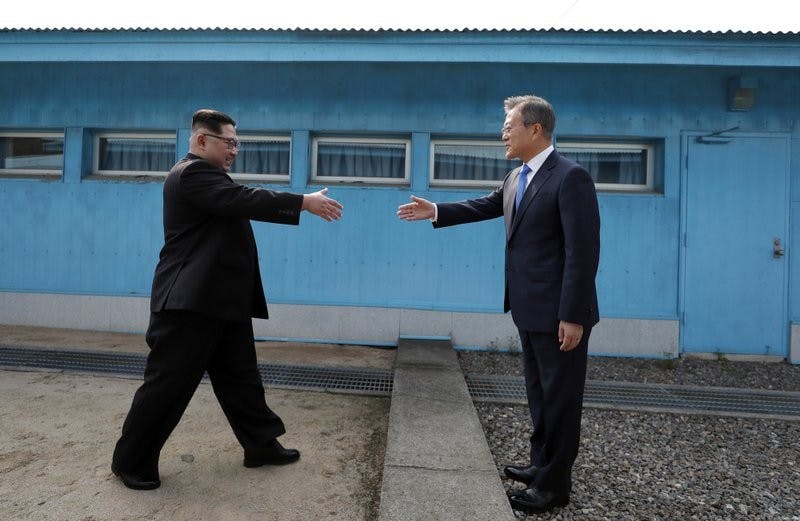 North Korean leader Kim Jong Un, left, prepares to shake hands with South Korean President Moon Jae-in at the border village of Panmunjom in Demilitarized Zone Friday, April 27, 2018. Their discussions will be expected to focus on whether the North can be persuaded to give up its nuclear bombs. Korea Summit Press Pool via AP, Photo Courtesy&nbsp;