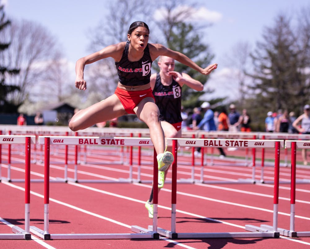 First-year hurdler Mary Porter leaps over hurdles at the Ball State Track and Field We Fly Challenge on April 15 at the University Track at Briner Sports Complex. Katelyn Howell, DN.