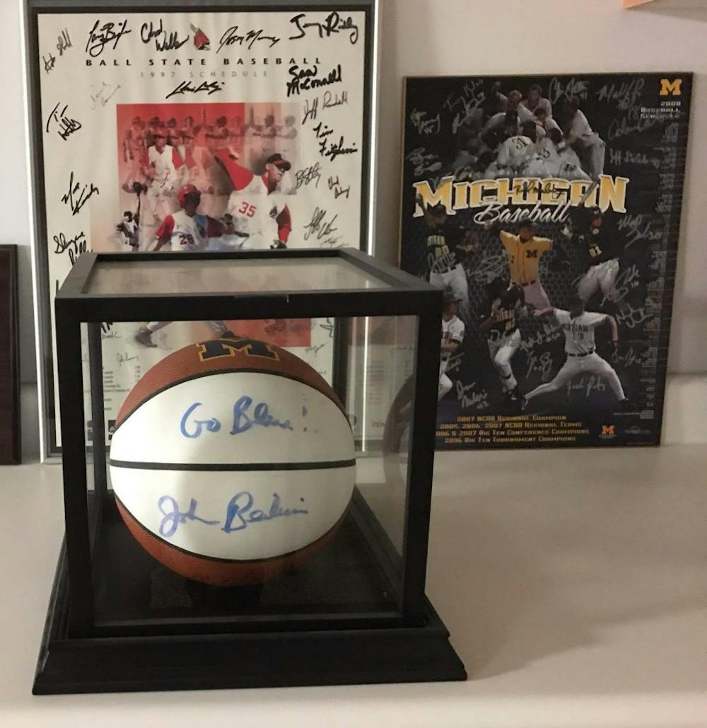 <p>Rich Maloney worked wth John Beilein at the University of Michigan from 2007-2012. Beilein gave an autographed basketball to Maloney, and the two remain close today. <strong>Rich Maloney, Photo Provided</strong></p>