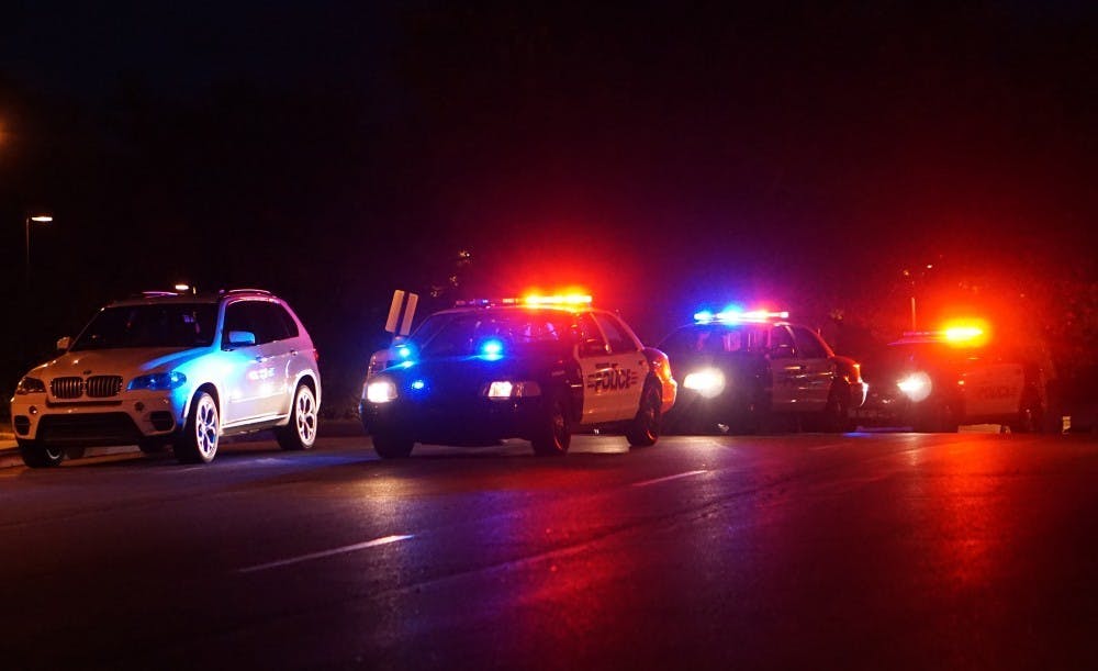 <p>Police vehicles respond to a gunman reported near DeHority and Woodworth complexes Sept. 1, 2016. A survey states<strong> </strong>56 percent of Hoosiers were at least “somewhat worried” about a shooting occurring in their local school.<strong> Bradley Jones, DN File</strong></p>