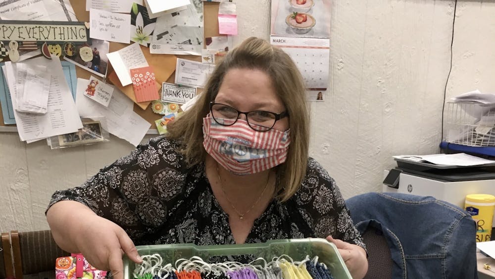 Shareen Wagley poses at The Mailroom with their new delivery of Susan's face masks. The Mailroom sells both Susan's and other local seamstresses adult- and child-sized masks. Moth Danner, Photo Provided