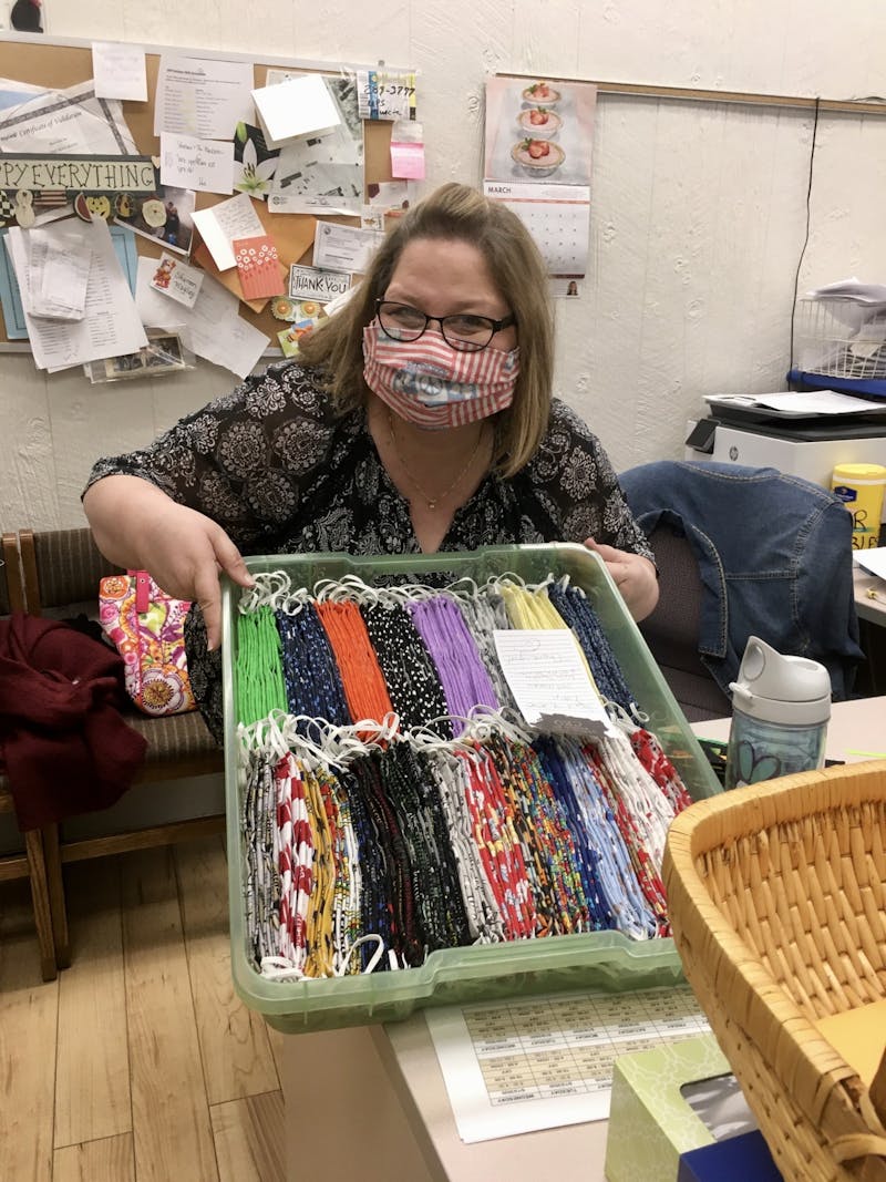Shareen Wagley poses at The Mailroom with their new delivery of Susan's face masks. The Mailroom sells both Susan's and other local seamstresses adult- and child-sized masks. Moth Danner, Photo Provided