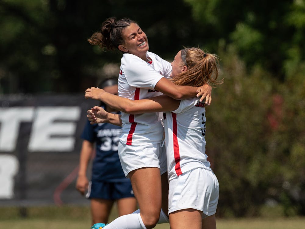 Junior defender Ryann Locante (left) jumps into the arms of teammate Avery Fenchel (right) after scoring a goal in the first of Ball State Soccer's game against Xavier Aug. 28 at the Briner Spoerts Complex. The Cardinals lost the match 4-2 to Xaiver. Eli Houser, DN