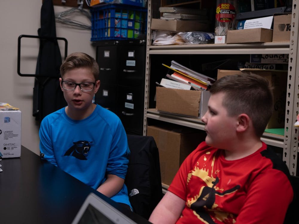 (Left to Right) Fifth grader Gavin Sharpe and second grader Brody Mccurdy talk at a table at Daleville Elementary School April 16, 2019. Sharpe is Mccurdy's big in the schools peer mentor program. Scott Fleener, DN