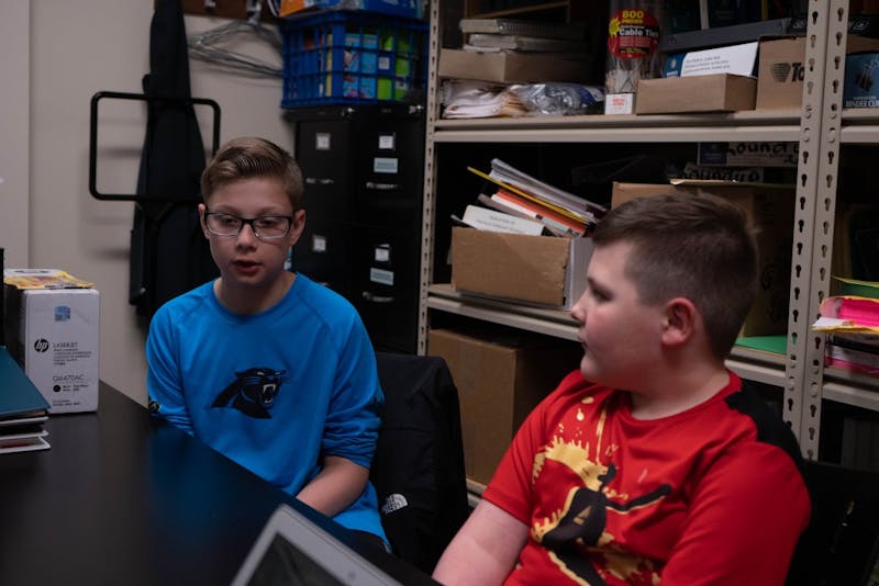 (Left to Right) Fifth grader Gavin Sharpe and second grader Brody Mccurdy talk at a table at Daleville Elementary School April 16, 2019. Sharpe is Mccurdy's big in the schools peer mentor program. Scott Fleener, DN