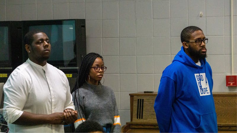 Sultan “Mufasa” Benson, Student Government Association senator Jordyn Blythe and Black Student Association President Jalen Jones hear a student’s opinion at the joint community forum Jan. 29, 2020, at the Arts and Communications Building. The two organizations held the meeting to assess the campus community climate following last week’s incident involving Benson and a professor. John Lynch, DN