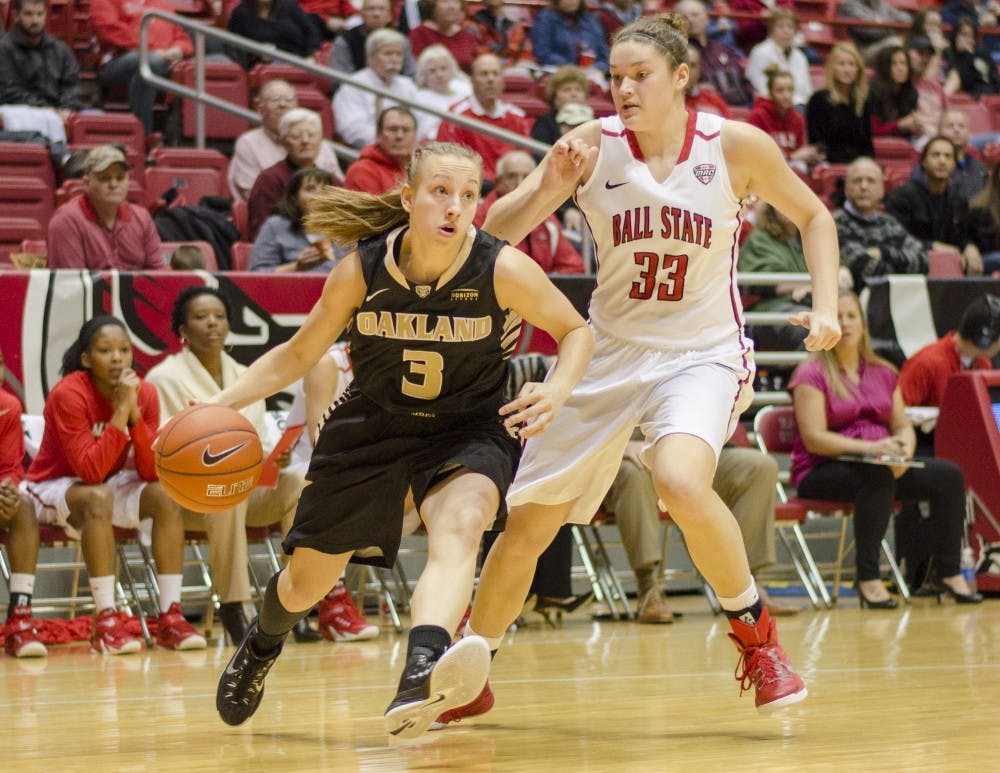Elena Popkey of Oakland attempts to get past freshman forward Moriah Monaco during the game on Dec. 6 at Worthen Arena. DN PHOTO BREANNA DAUGHERTY