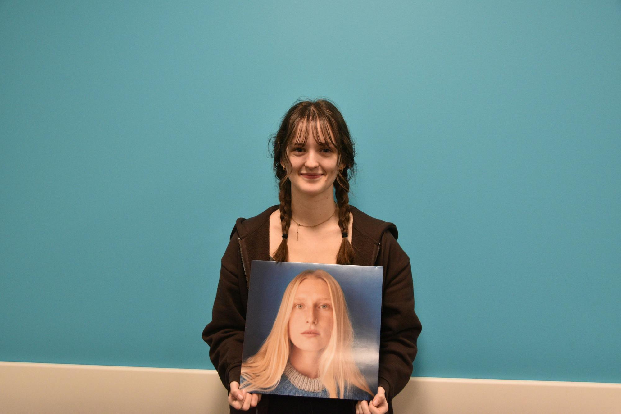 Disk Junkies’ Outreach Officer Simone Robinson-Stevens poses with an album she enjoys. The album is Billie Marten’s most recent, “Drop Cherries.” Ella Howell, DN