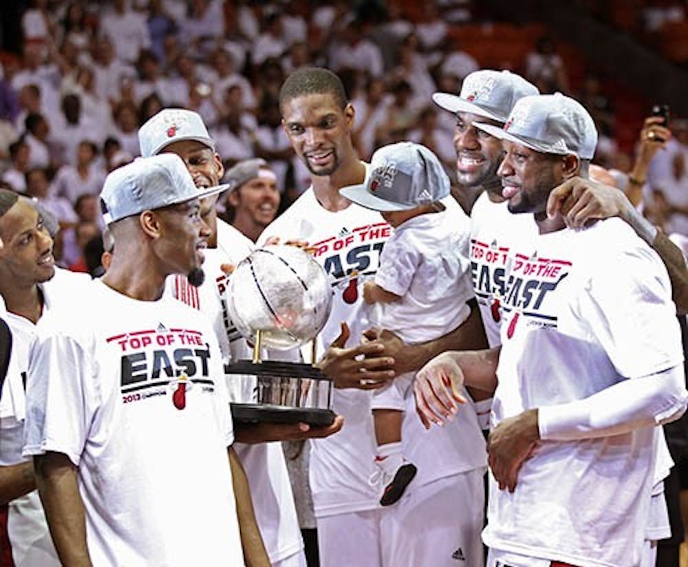 The Miami Heat celebrate defeating the Indiana Pacers in Game 7 of the NBA Eastern Conference Finals on Monday at American Airlines Arena in Miami, Fla. MCT PHOTO