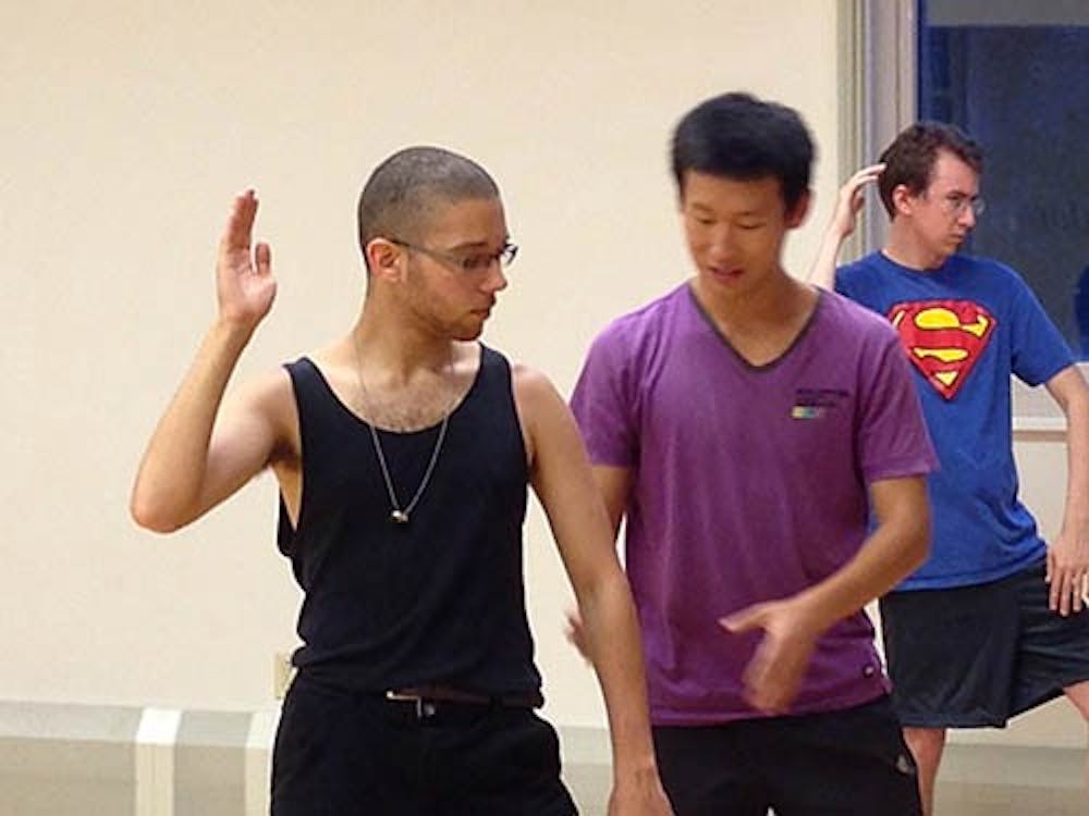 Sophomore computer science major Junhong Xu, a tai chi instructor, adjusts sophomore Japanese major Aaron Gant’s form during a meeting of the Kung Fu Club. Club membership is open to students regardless of experience with martial arts, and it hosts social gatherings as well as lessons. DN PHOTO JEREMY ERVIN