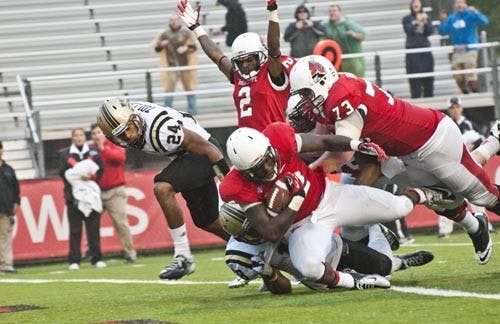 Sophomore running back Jahwan Edwards is pushed into the end zone during overtime of the game against Western Michigan on Oct. 13. The Cardinals took the Homecoming game 30-24. DN FILE PHOTO JONATHAN MIKSANEK