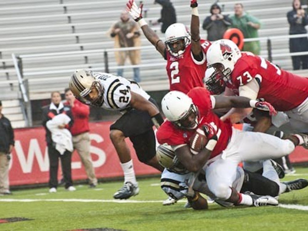 Sophomore running back Jahwan Edwards is pushed into the end zone during overtime of the game against Western Michigan on Oct. 13. The Cardinals took the Homecoming game 30-24. DN FILE PHOTO JONATHAN MIKSANEK