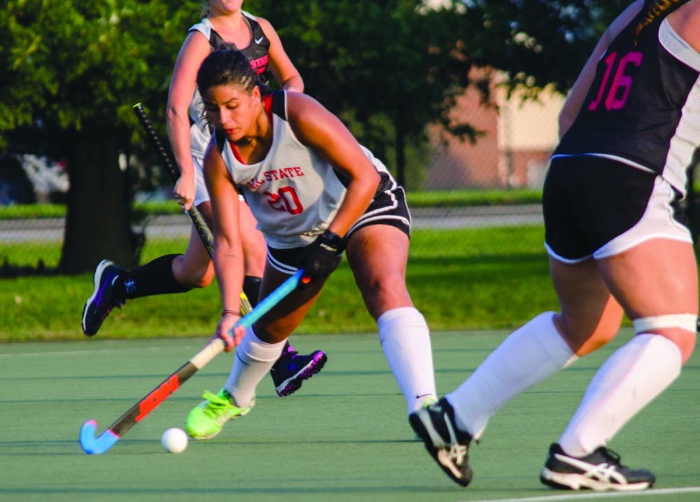 Junior Arantxa Rosainz Caloca, #20 swings the hockey stick towards the ball during practice  Sept. 17, 2018, at the Briner Sports Complex.  Stephanie Amador, DN